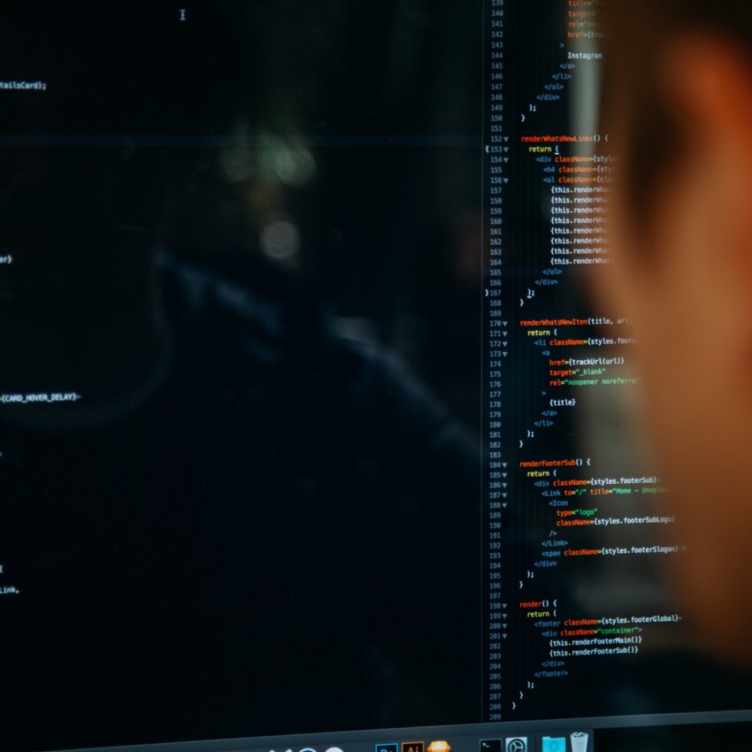 Close-up of a programmer working on a code