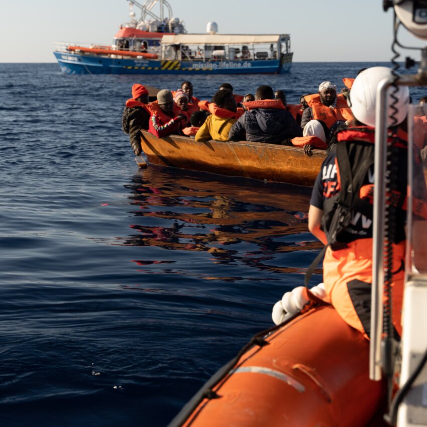 Rescue mission on the Mediterranean Sea: A metal boat full of people.